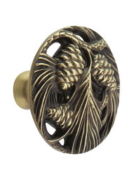 Cones and Boughs Cabinet Knob in Antique Brass.